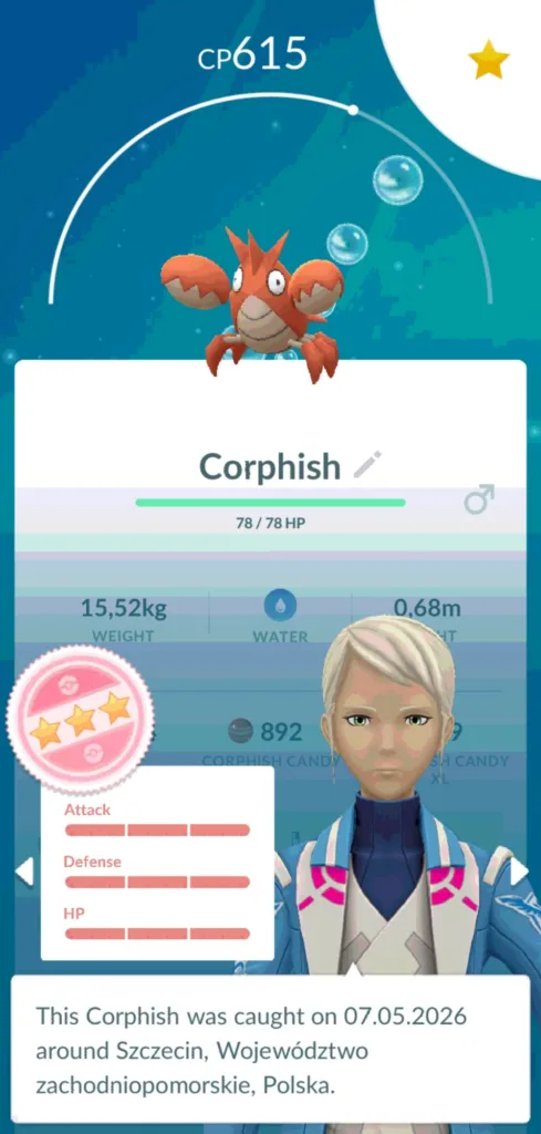 Pomarańczowy Corphish z gry Pokemon GO z widocznymi statystykami i datą złapania