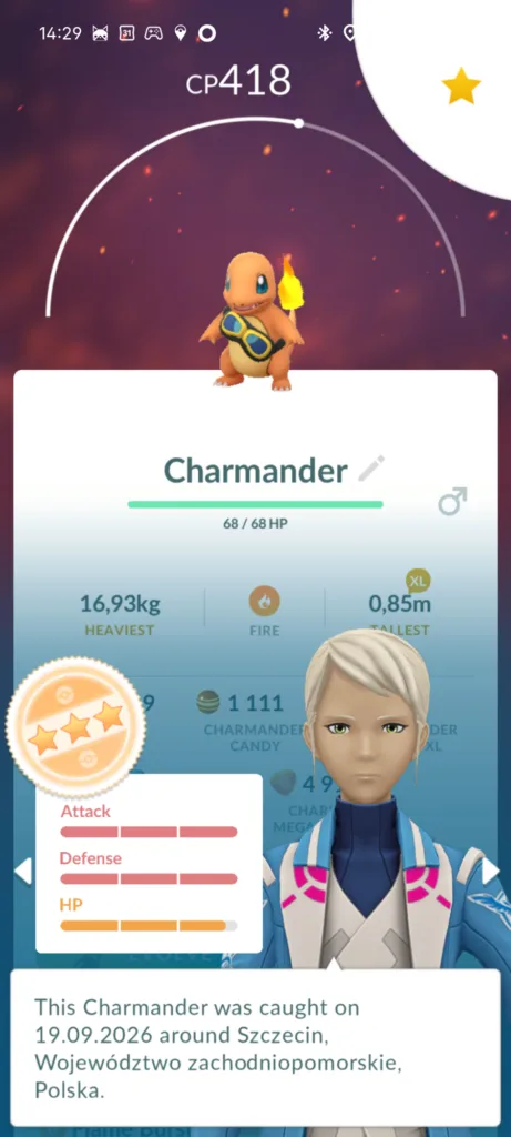 Zrzut ekranu z gry Pokémon GO przedstawiający statystyki Charmandera z CP 418 oraz panelem oceny postaci prezentowanym przez lidera Team Mistic.