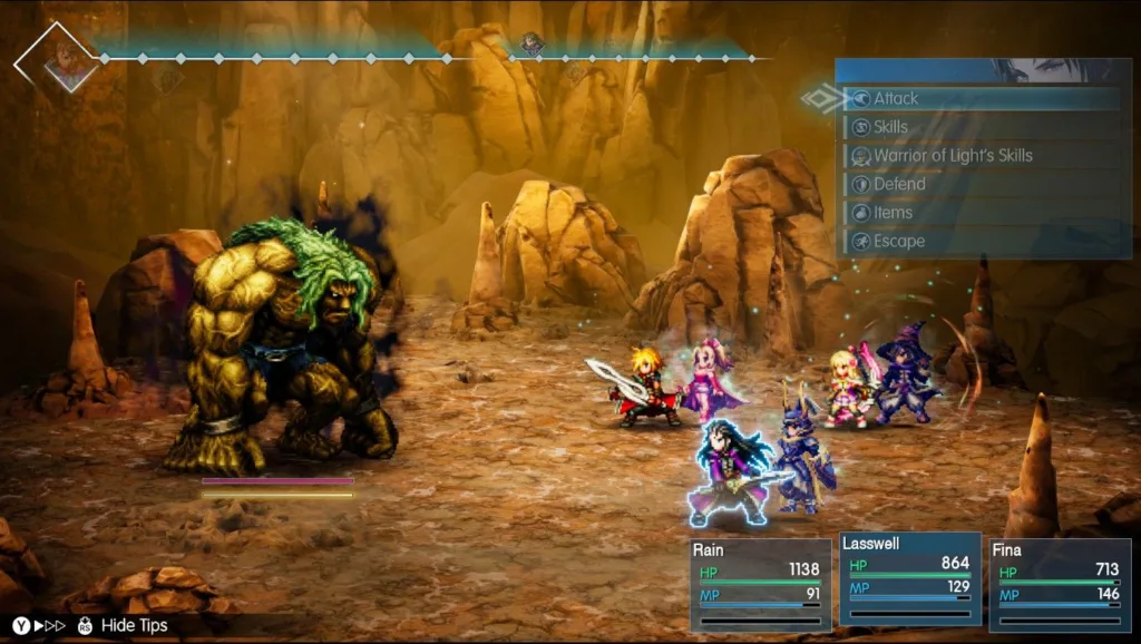 Zrzut ekranu przedstawiający turową walkę w grze Final Fantasy Resonance z udziałem postaci Rain, Lasswell i Fina walczących z dużym potworem w skalistej jaskini.